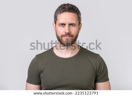 portrait of caucasian man with stubble isolated on grey background. caucasian man with stubble Royalty-Free Stock Photo #2235123791