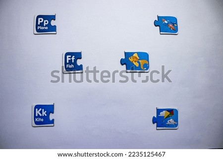 Knowledge puzzles with kites, airplanes and fish pictures and texts, arranged in a jumbled manner on a white background.