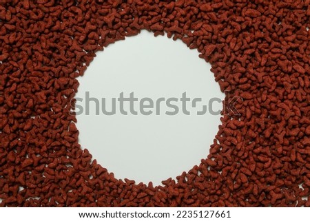 Red pet feed on white background, space for text Royalty-Free Stock Photo #2235127661