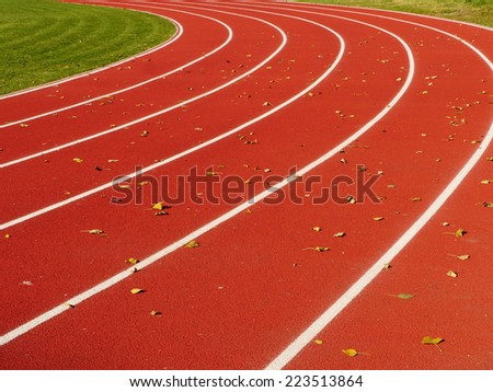 Red Running Track with white lines  at stadium