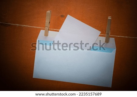 An envelope for written messages on a dark abstract background. Outdated way of transmitting information
