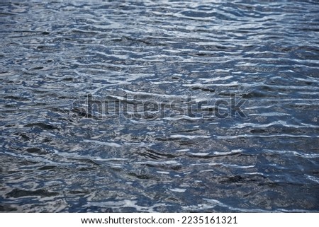 glare and ripples on the water surface