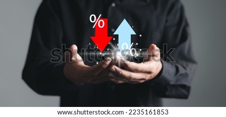 Businessman showing percentage icons and up and down arrow icons with graph indicators. Concept of financial interest rates and mortgage rates.  Interest Rates Stocks Finance Ratings Mortgage Rates. Royalty-Free Stock Photo #2235161853