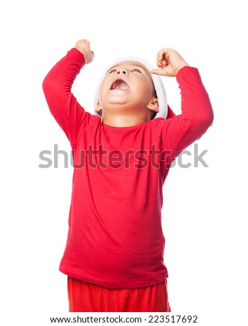 portrait of a little boy celebrating gesture