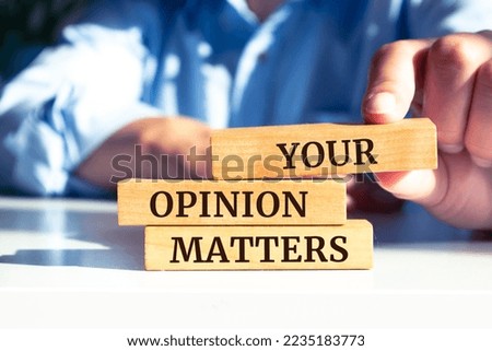 Wooden blocks with words 'Your Opinion Matters'.