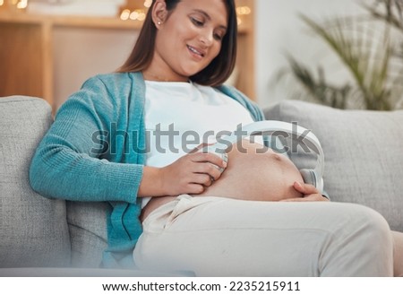 Relax, pregnancy music and woman with a smile for podcast for child in stomach, streaming audio and love on the sofa. Pregnant sound, headphones and mother with care for baby in belly on the couch