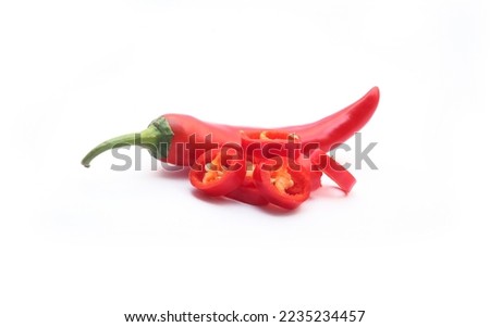 Organic fresh chili pepper with sliced isolated on white background. Ripe red hot natural chili peppers vegetable. Royalty-Free Stock Photo #2235234457