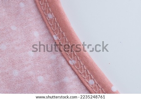 knitwear textile, machine stitching, sewing knots