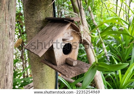 Wooden birdhouse for garden decoration.