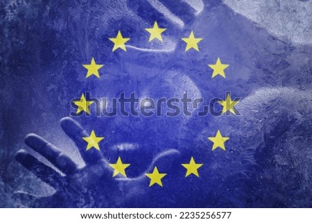 Crisis in Europe. Flag of the European Union with a human hand. Crisis concept. Selective focus. Copy space.