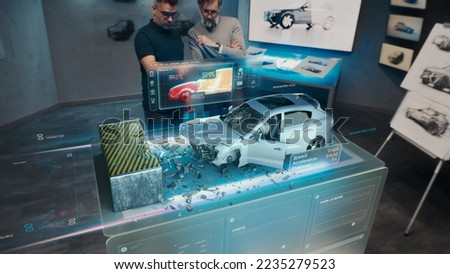 Two engineers Developers standing in design studio near futuristic holographic table and make a test in a 3d car crash test simulator, which simulates a road accident check the safety