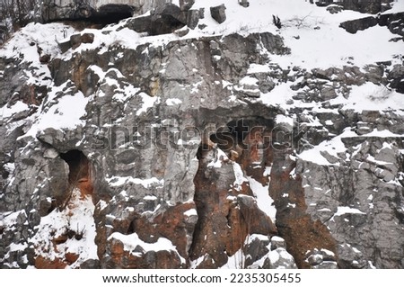 Rocks with caves in winter