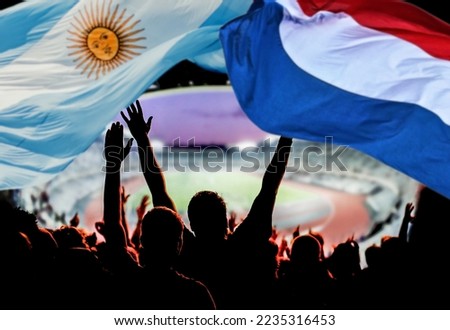 soccer supporters and Netherlands vs Argentina flag