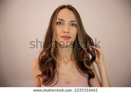 Beautiful hairstyle of young woman after dyeing hair and making highlights in hair salon. Hair bleaching technique Babylights, Balayage, Highlights, Lowlights, Ombre highlights Royalty-Free Stock Photo #2235316661