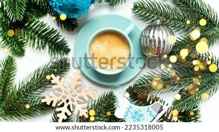 
christmas background with a cup of coffee and fir branches and decorations with bokeh lights isolated on a white background. top view. copy space. flat lay