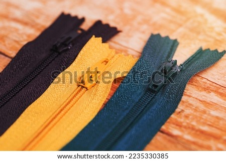 A line three different zips Royalty-Free Stock Photo #2235330385