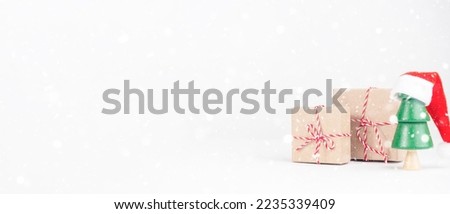 Christmas tree with boxes on a light background. New Year's Eve, Christmas and presents concept.