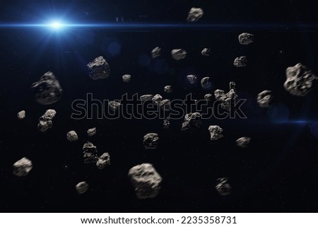 Asteroid belt. Meteorites and Sun. High resolution space background.  Science fiction art. Elements of this image furnished by NASA.