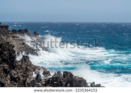 waves crashing on rocks splashing waves