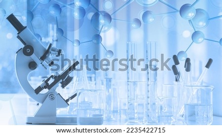 laboratory research and development background of laboratory instrument microscope and lab glassware overlay with molecules symbol Royalty-Free Stock Photo #2235422715