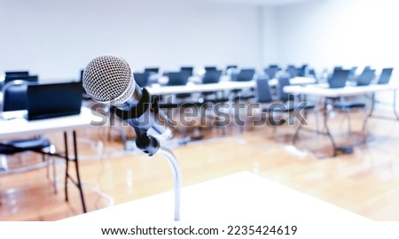 Close up microphone with laptop on table background in seminar room