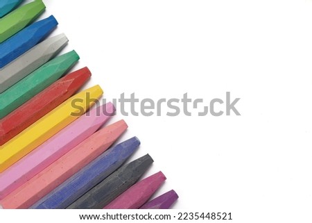Colorful oil pastels photographed on a white background