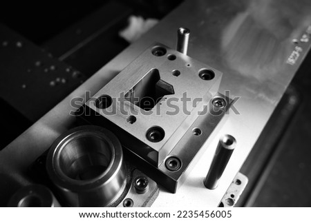 Sheet Metal Stamping Tool Die for Automotive Precision Parts on The Numerical Control Milling Machine Table. Tandem Stamping System. At a High Quality Technology Factory. Black and White Photography. Royalty-Free Stock Photo #2235456005
