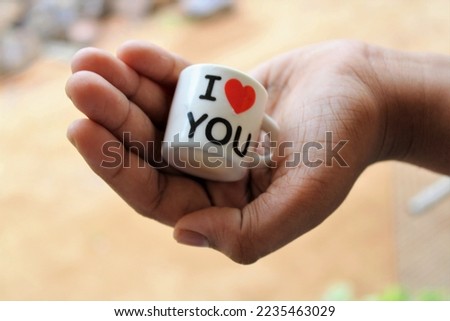 I love you love cup in woman hand image