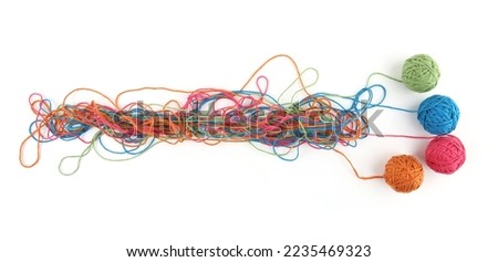 Tangled colorful cotton threads and balls isolated on white background. Abstract thread lines chaos pattern. Royalty-Free Stock Photo #2235469323