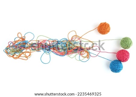 Tangled colorful cotton threads and balls isolated on white background. Abstract thread lines chaos pattern. Royalty-Free Stock Photo #2235469325