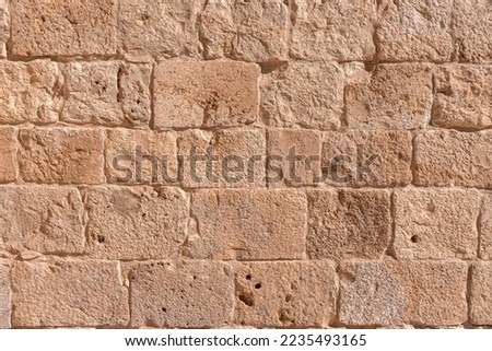 Surface of old wall made of the Jerusalem stone. Israel