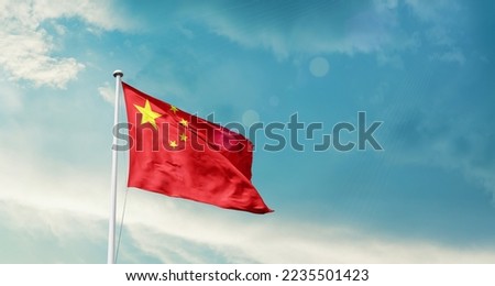 China national flag waving in beautiful sky. Royalty-Free Stock Photo #2235501423