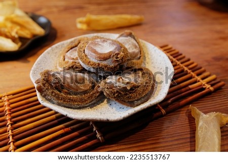 Expensive ingredients Dried abalone and dried fish maw Royalty-Free Stock Photo #2235513767