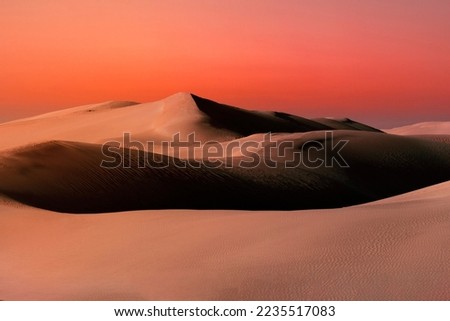 Beautiful and colorful sunset with colorful sand dunes