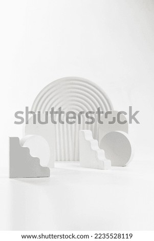 White props for product photography on white seamless background - half-circles, oval doors, rippled arch, zig-zag stairs Royalty-Free Stock Photo #2235528119