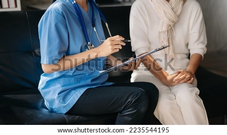 Kind nurse together with elderly woman in the hospital's or home
