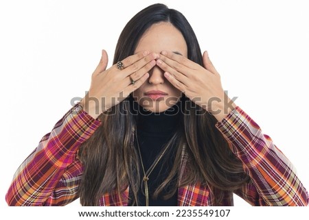 medium closeup shot of a young lady covering her eyes, studio shot isolated. High quality photo