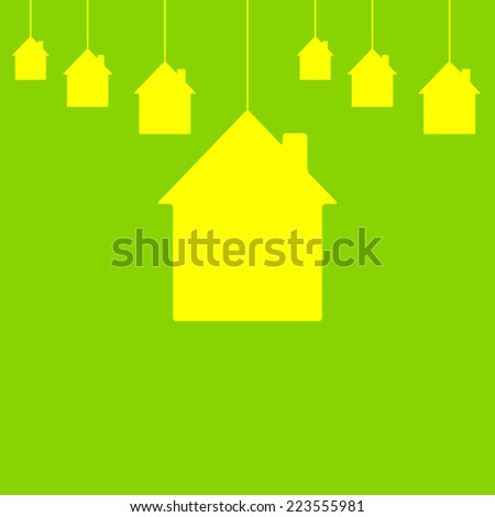 Lemon colored houses hanging on bright green background. New house concept