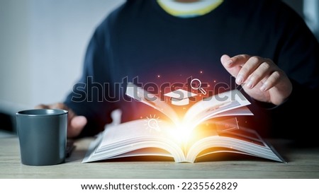 Student education concept. Education, learning on school and university or idea concept. Open book with light bulb and graduation cap Royalty-Free Stock Photo #2235562829