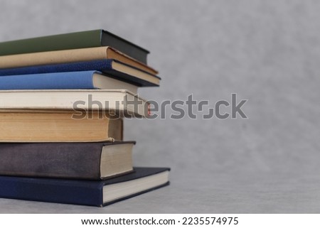 Pile of books on gray background