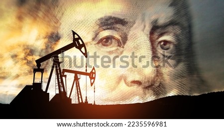Oil price cap concept. Petroleum, petrodollar and crude oil concept. Oil pump on background of US dollar. Dollar and oil pumps Royalty-Free Stock Photo #2235596981