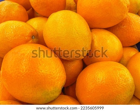 Oranges in market stalls. Take a horizontal close-up shot.