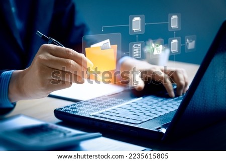 Document Management System (DMS), software to store, organize, track, and manage digital documents. Centralized repository for efficient creation, storage, retrieval, and distribution. Royalty-Free Stock Photo #2235615805