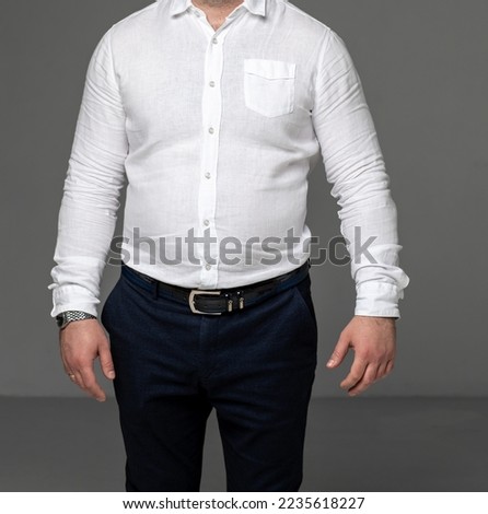 without a face. a man in a white shirt and classic trousers. the concept of clothing for men.