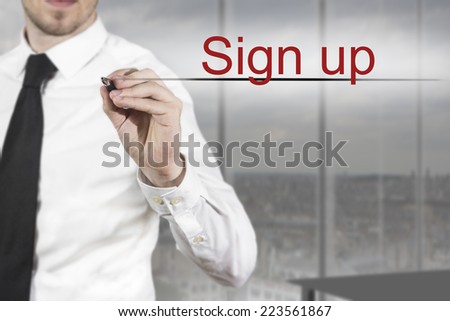 businessman in office writing in the air sign up