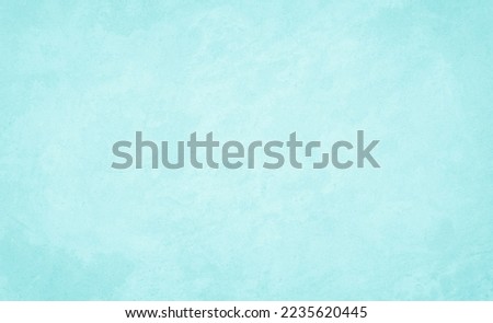 Pastel blue and white concrete stone texture for background in summer wallpaper. Cement and sand wall of tone vintage. Concrete abstract wall of light cyan color, cement texture mint green for design.