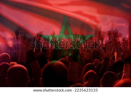 Flag of Morocco overs soccer or football fans Royalty-Free Stock Photo #2235623133