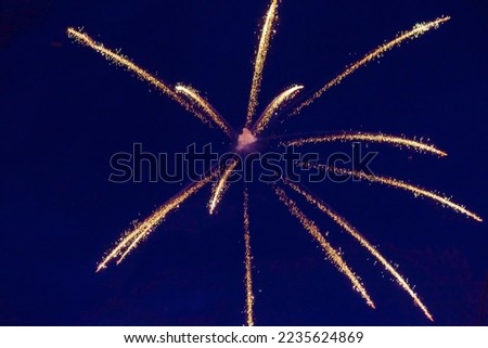 Inexpensive, budget, beautiful fireworks in the city, against the backdrop of the night sky. High quality photo