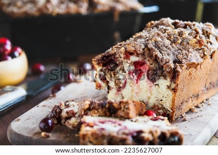 Rustic image of homemade cranberry sweet bread for Christmas. Selective focus with blurred foreground and background.