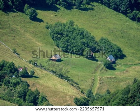 Rural landscape in Apuseni mountains, near the Cluj Napoca city, Romania Royalty-Free Stock Photo #2235657571